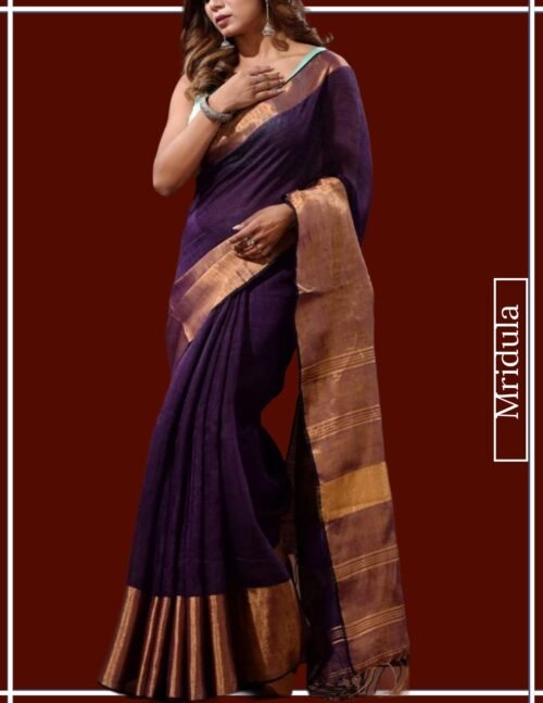 Woman wearing a pure linen saree in purple with copper zari border by Mridula