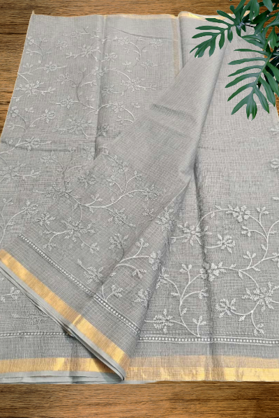 Grey Kota cotton saree with white floral embroidery and golden border by Mridula