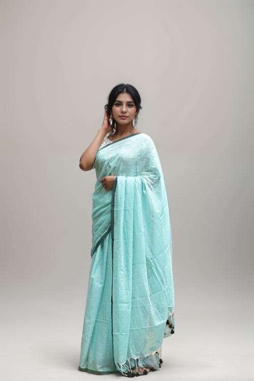 Woman wearing Mridula pastel mint green mul cotton saree