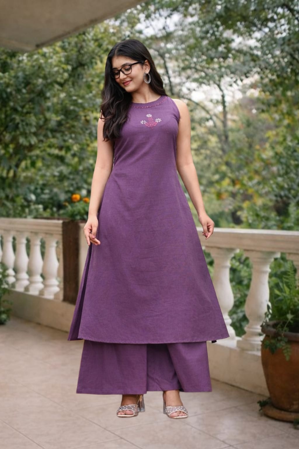 Woman wearing purple cotton slub A-line halter neck co-ord set with embroidered kurta and pants
