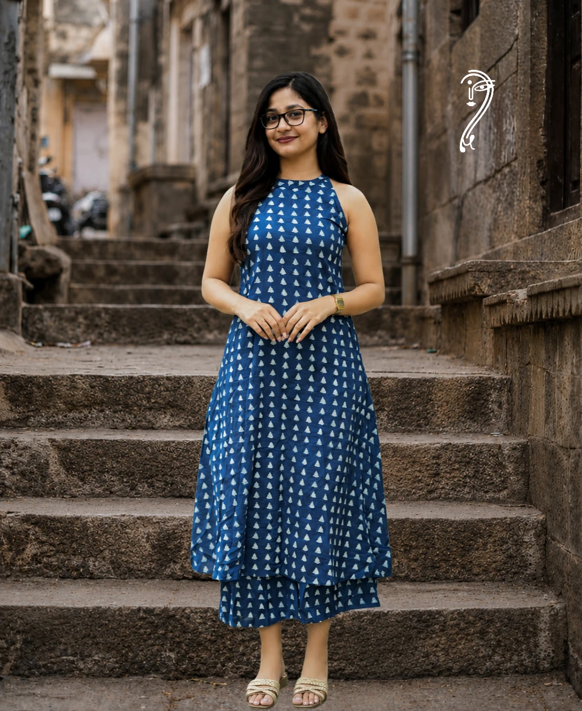 Woman wearing indigo blue cotton kurta pant set with halter neck