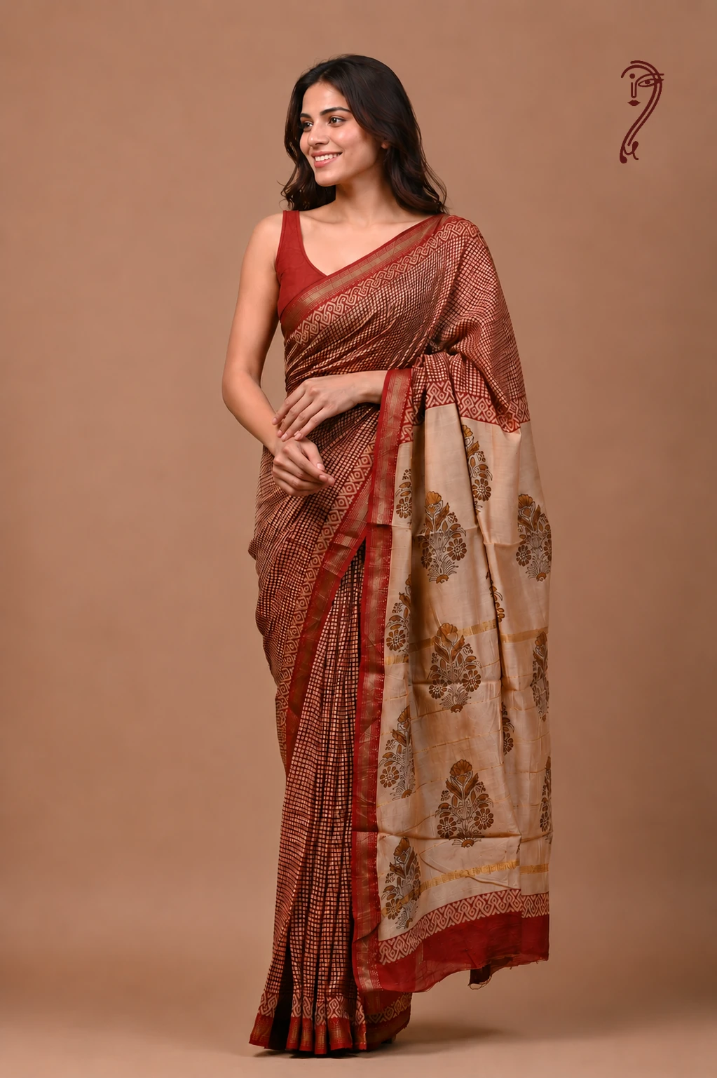 Woman wearing maroon checks Maheshwari cotton silk saree with floral beige pallu