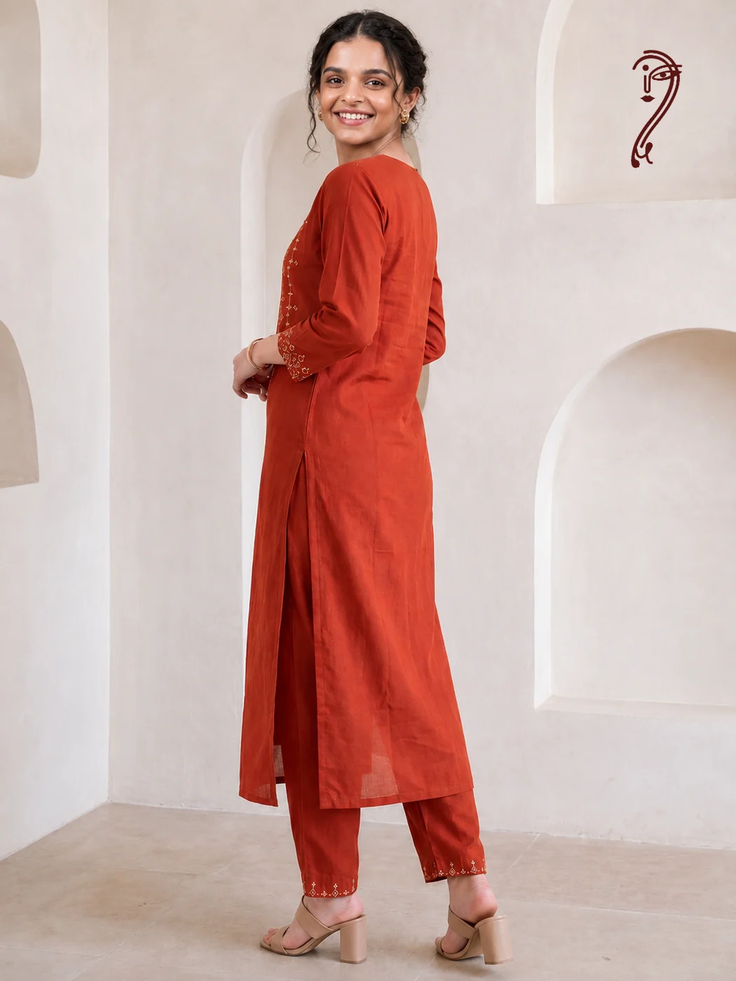 Rust orange embroidered cotton kurta set for women, back view with side slit